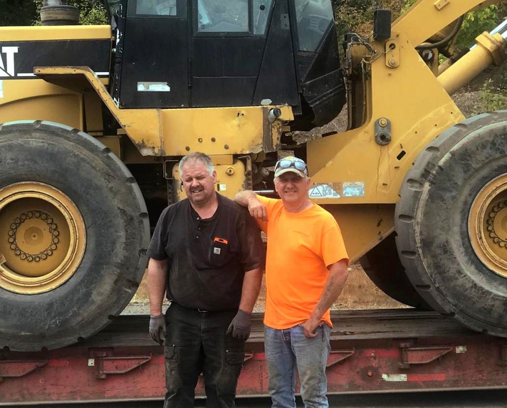 2 men near machinery estacada sand and gravel